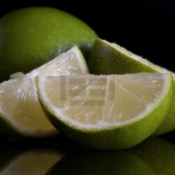 Freshly Cut Limes On a Black Background